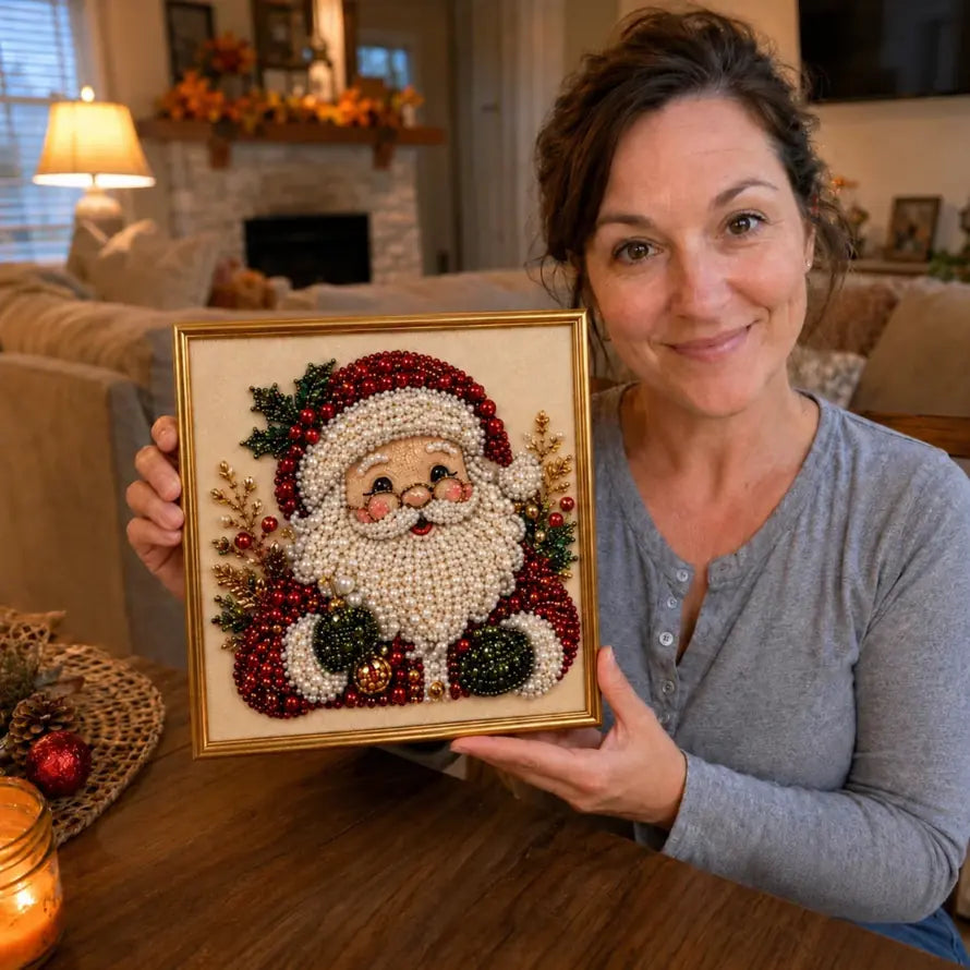 Woman holding a completed Santa bead mosaic in a display frame